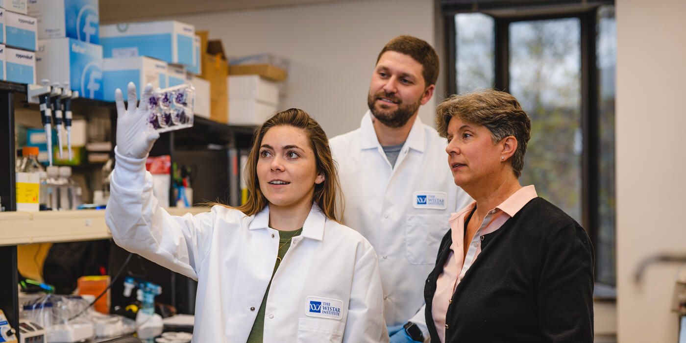 Dr. Maureen Murphy with two PhD students in her Wistar lab